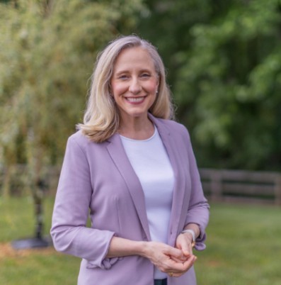 A photo of Abigail Spanberger smiling.